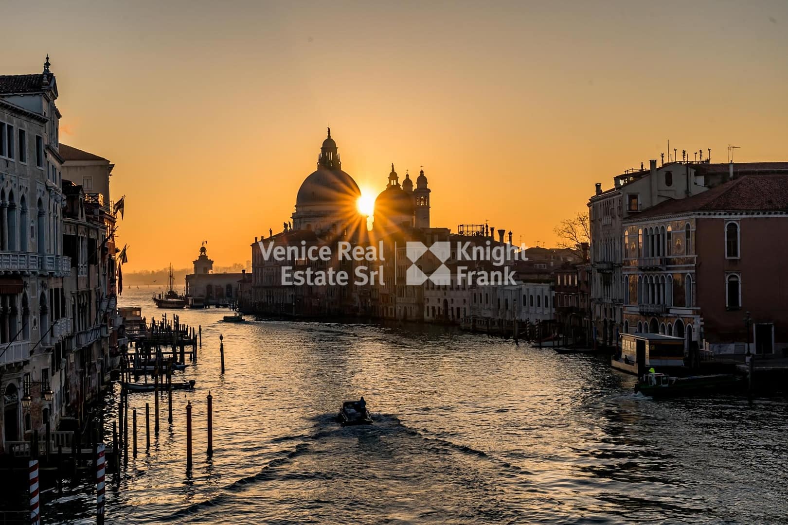Beautiful Grand Canal channel in Italy at night with lights reflecting in the water